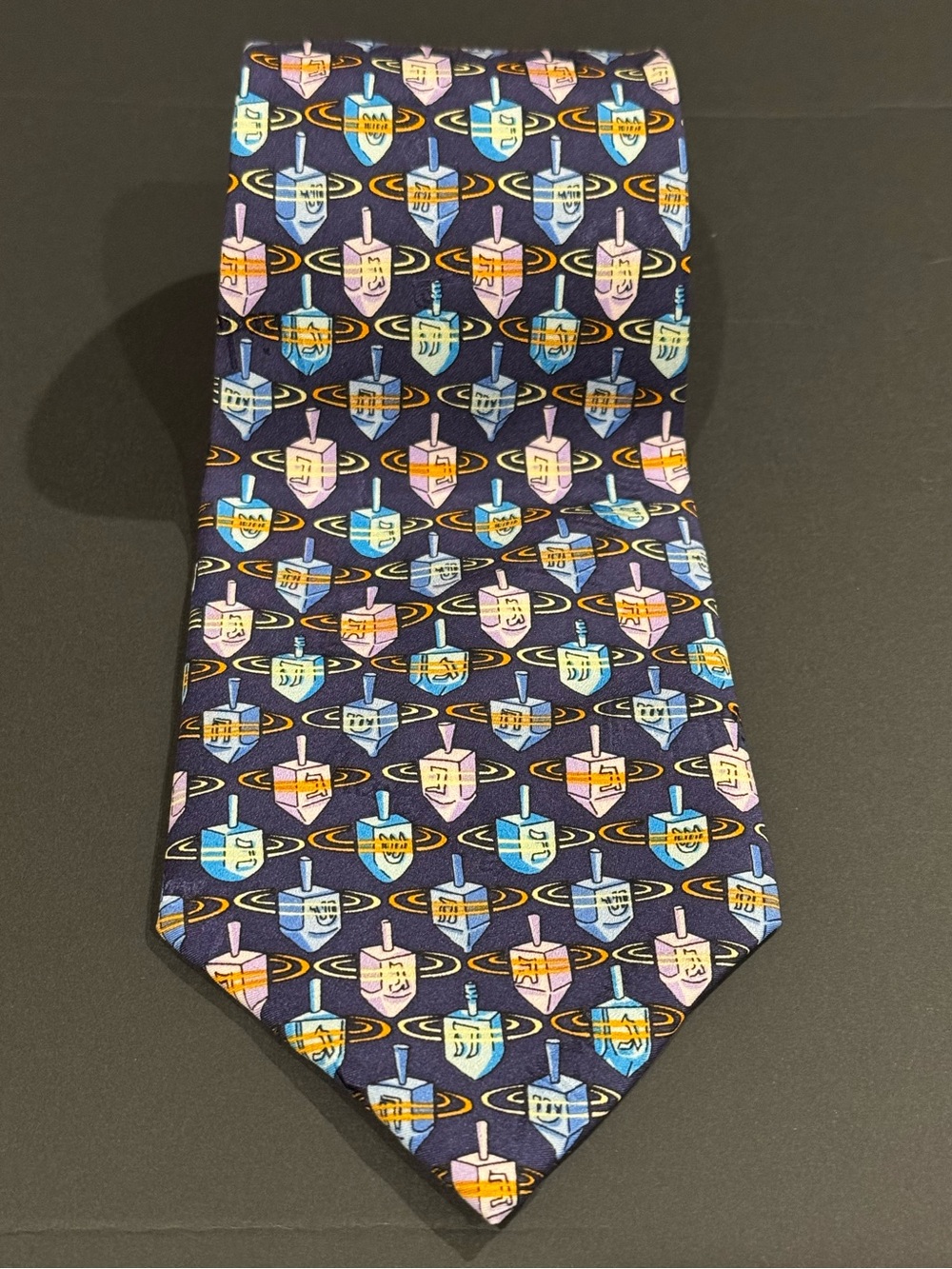 Hanukkah inspired silk tie with dreidel pattern by Nicole Miller NYC